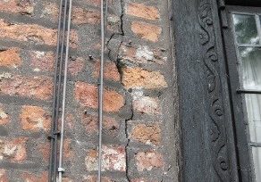 Taken in Trafford, Greater Manchester, shows brickwork from around 1700 cracked as a result of later alterations.